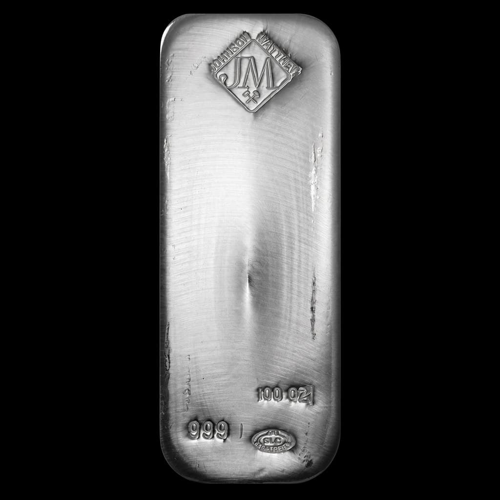 100 oz Johnson Matthey poured silver bar showing the JM diamond hallmark with 100 OZ, 999, and SLC refinery stamps