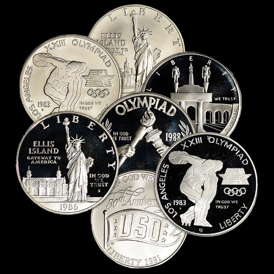 Assorted U.S. $1 silver commemorative coins in proof and uncirculated finishes