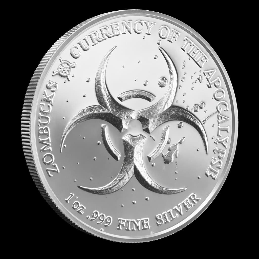 1 oz Zombucks The Saint silver round showing Liberty with a sword and severed zombie head over a field of skeletons (reverse)